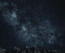 Star-filled night sky over mountains Starry sky with Milky Way over mountains